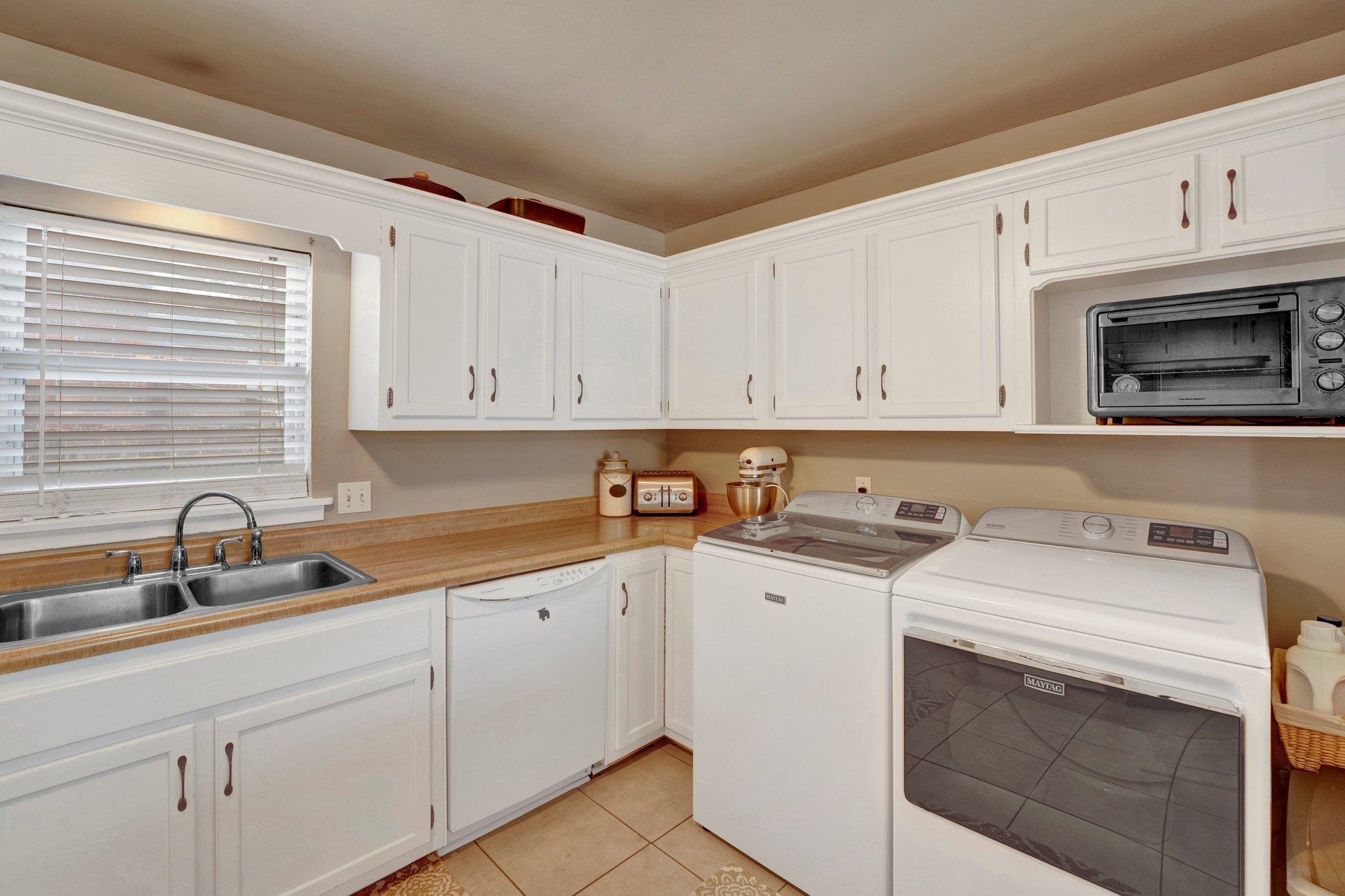 4891 Flamingo Road Memphis, TN 38117 - Photo 23 of 34 a view of a kitchen with cabinets appliances and a sink