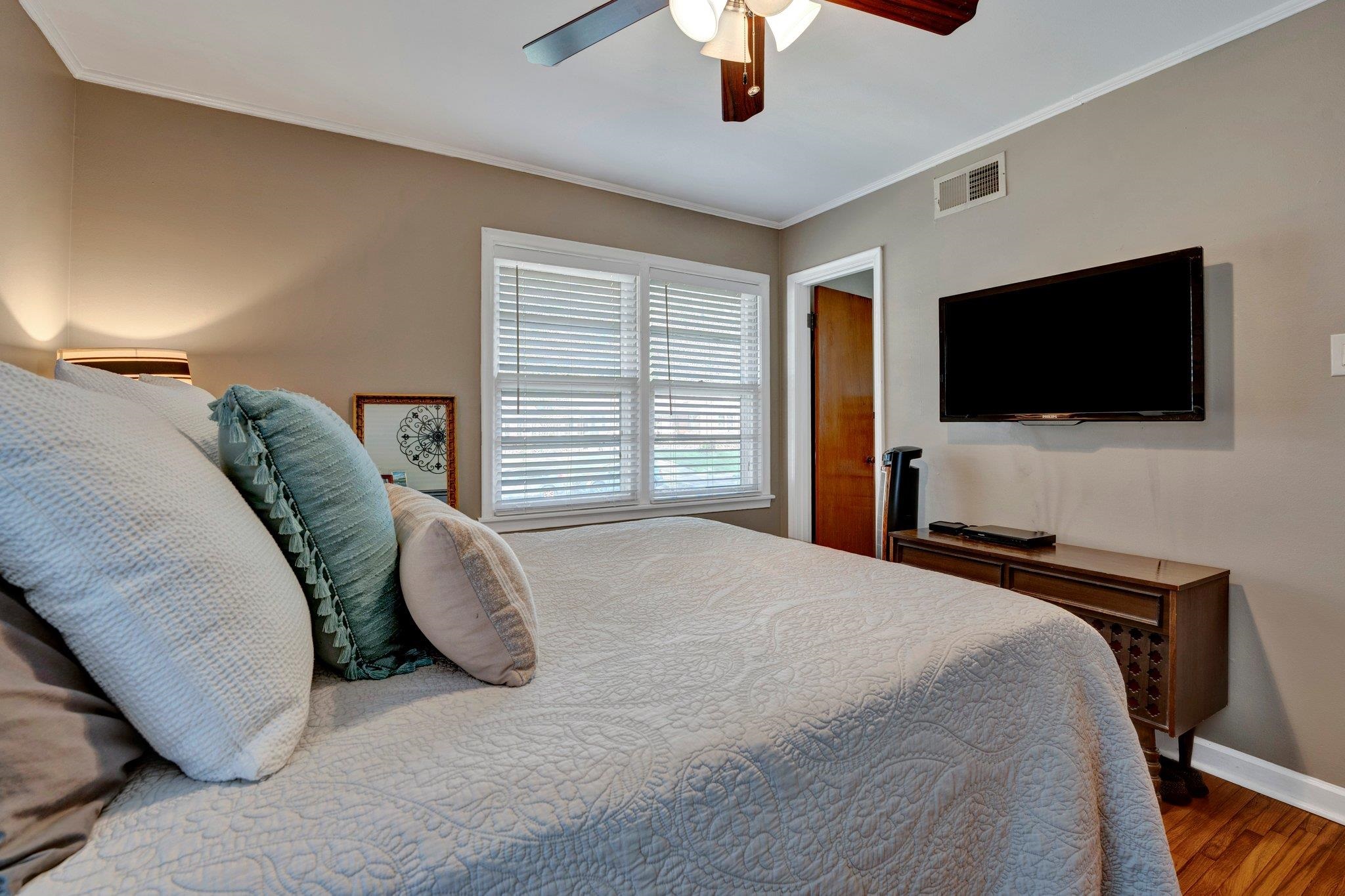4891 Flamingo Road Memphis, TN 38117 - Photo 24 of 34 a bedroom with a bed and a flat screen tv
