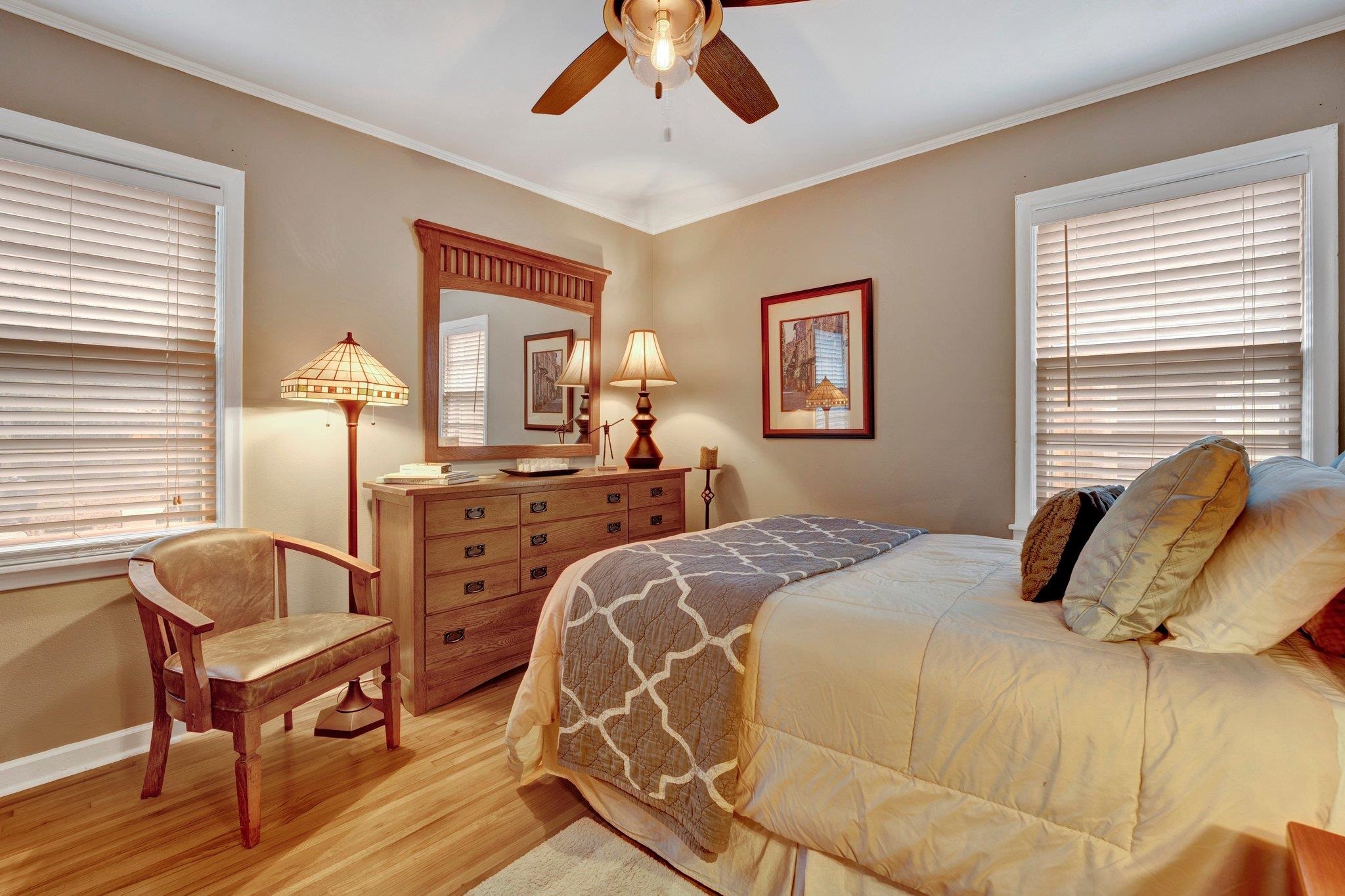 4891 Flamingo Road Memphis, TN 38117 - Photo 26 of 34 a bedroom with a bed and a chandelier