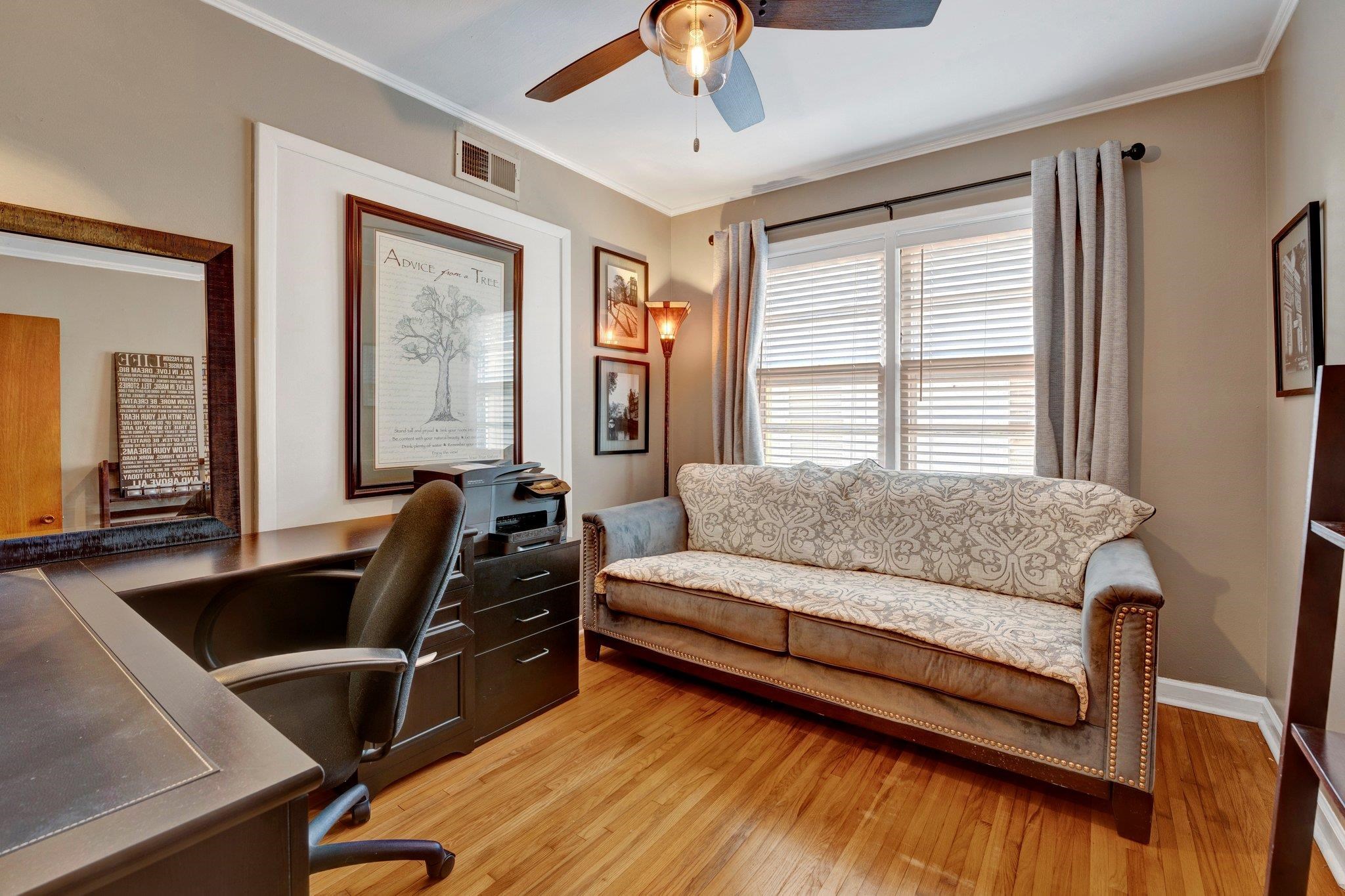 4891 Flamingo Road Memphis, TN 38117 - Photo 28 of 34 a bedroom with a bed and wooden floor
