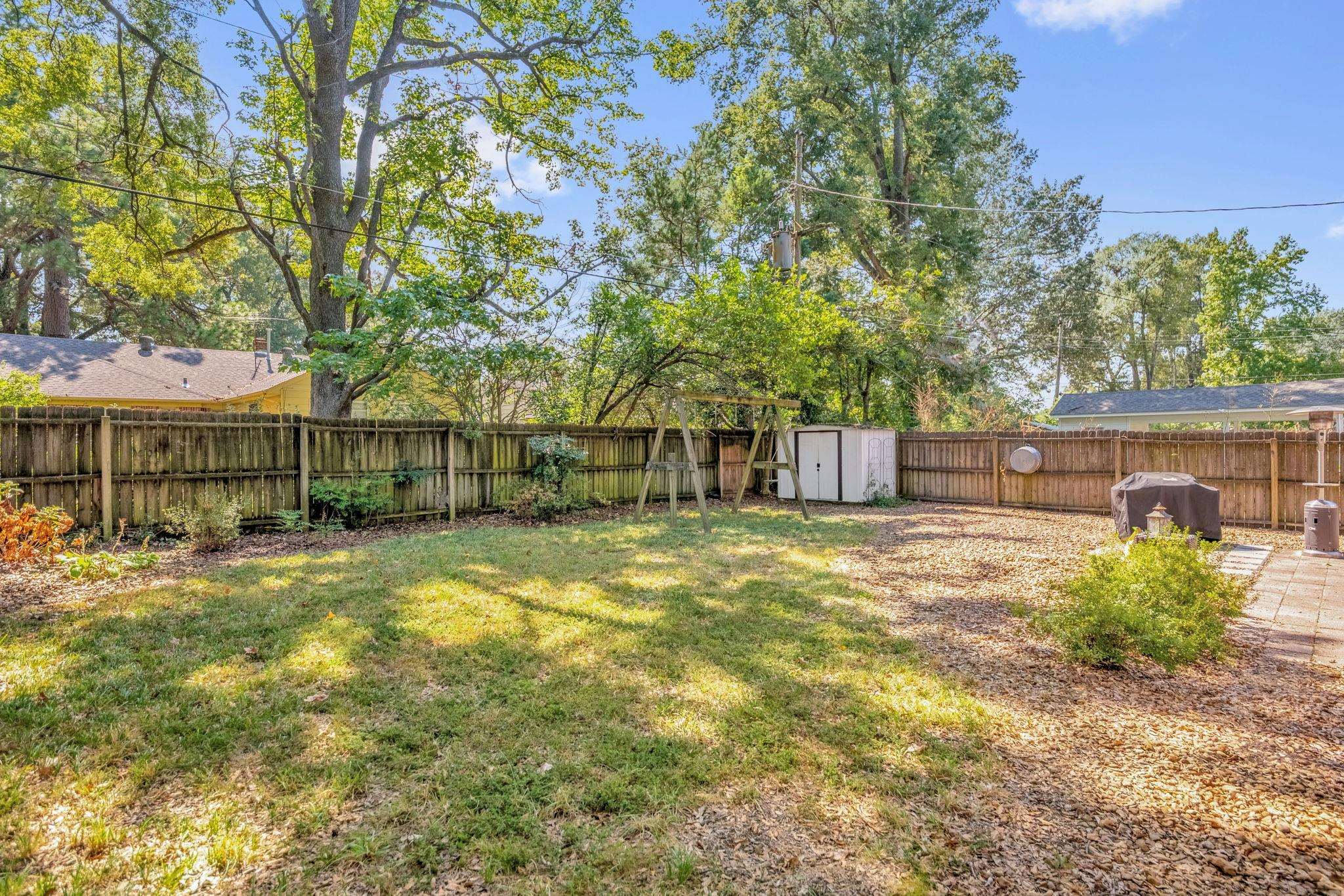 4891 Flamingo Road Memphis, TN 38117 - Photo 33 of 34 a view of a house with backyard and sitting area
