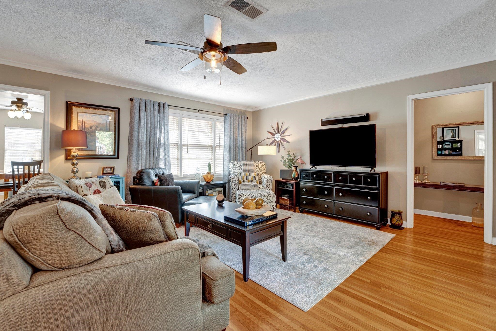 4891 Flamingo Road Memphis, TN 38117 - Photo 10 of 34 a living room with furniture and a flat screen tv