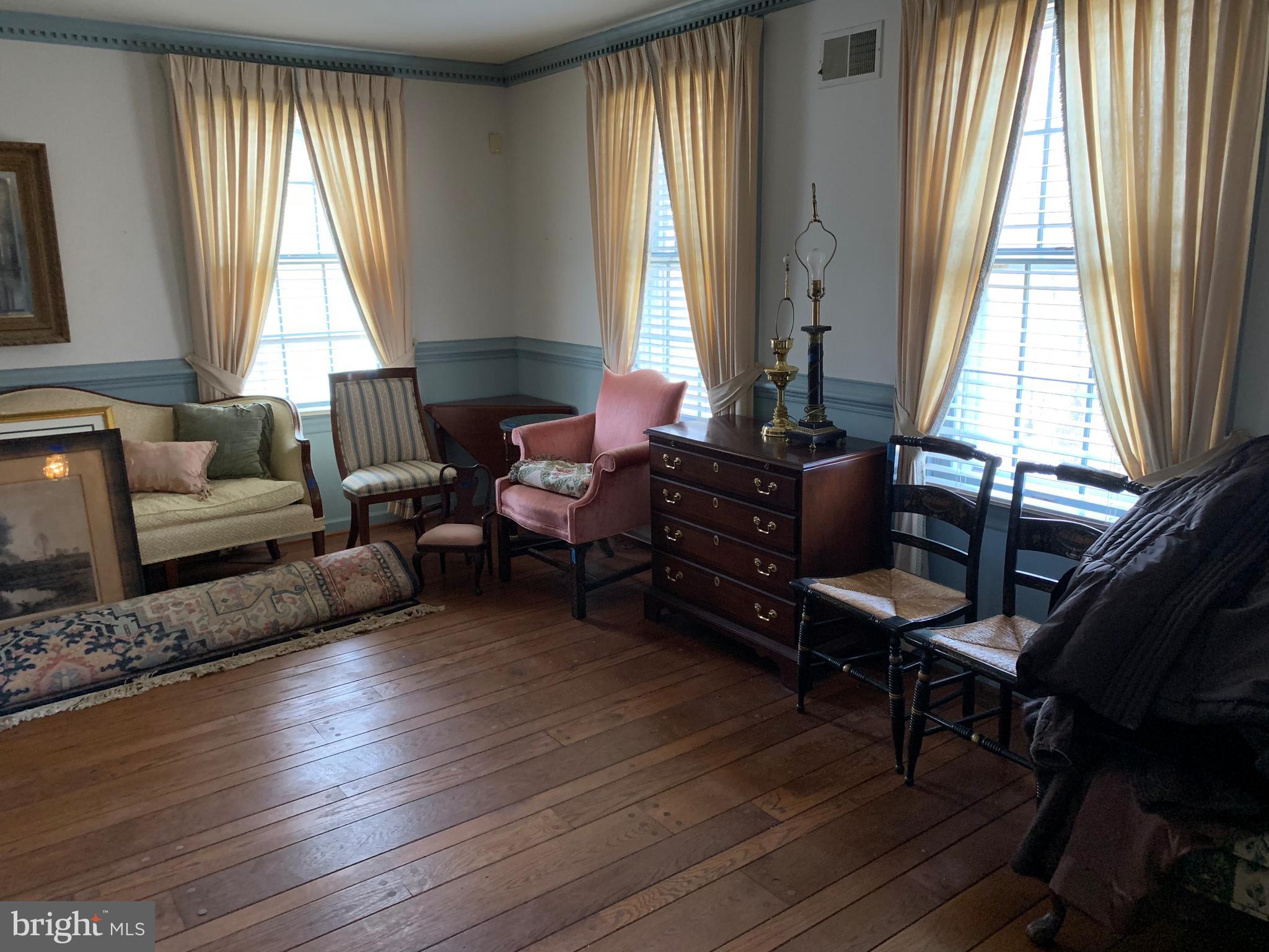 7603 Irongate Lane Frederick, MD 21702 - Photo 20 of 43 a living room with furniture and a large window