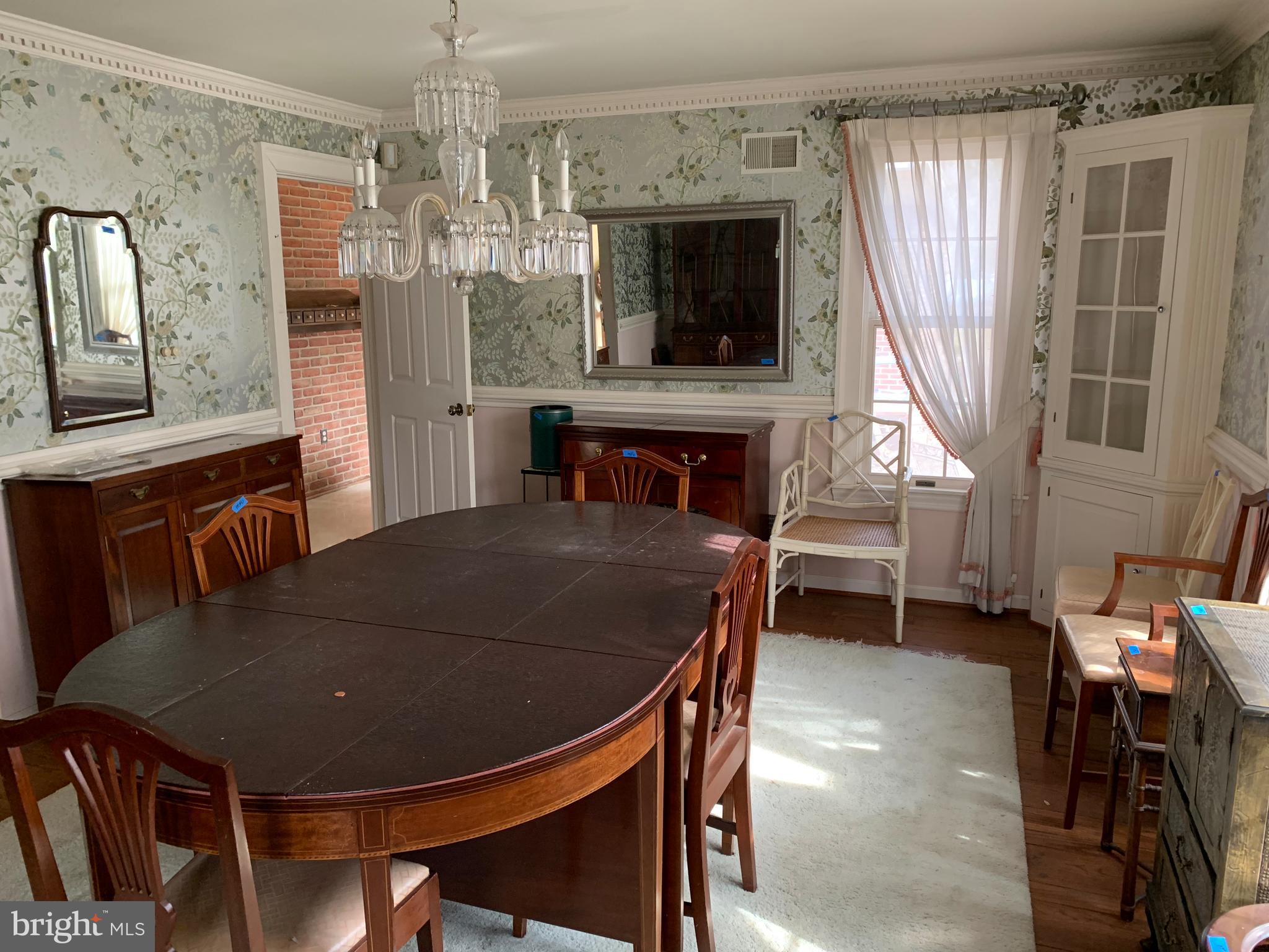 7603 Irongate Lane Frederick, MD 21702 - Photo 25 of 43 a view of a dining room with furniture window and wooden floor