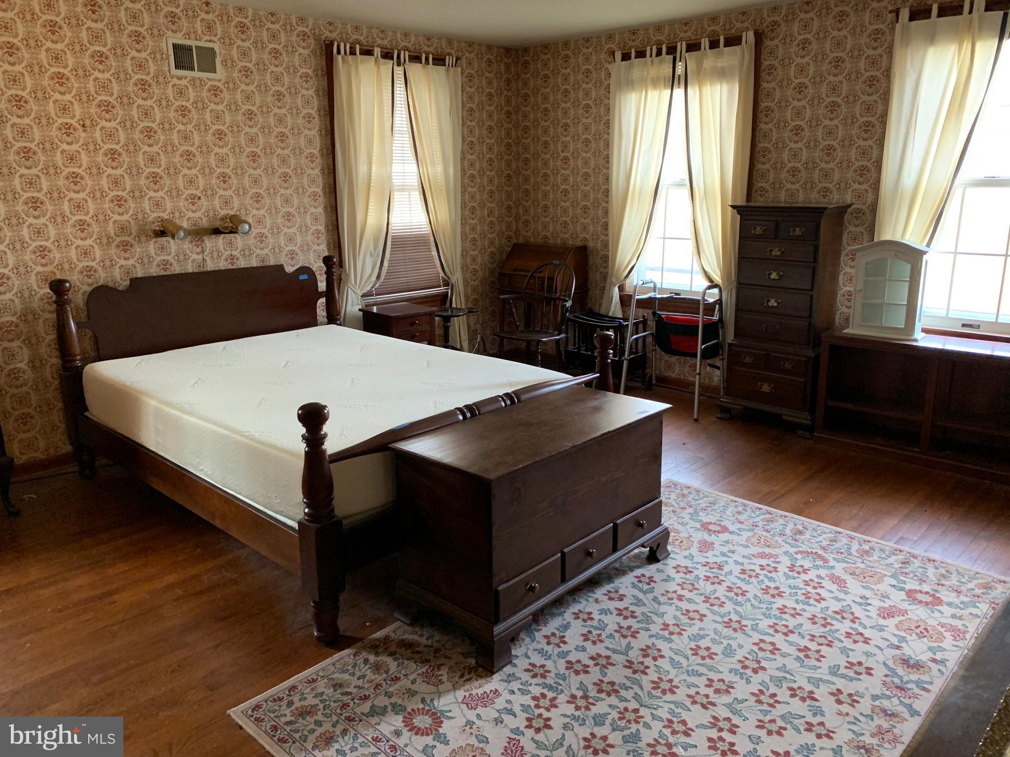 7603 Irongate Lane Frederick, MD 21702 - Photo 27 of 43 a bed sitting in a bedroom next to a window