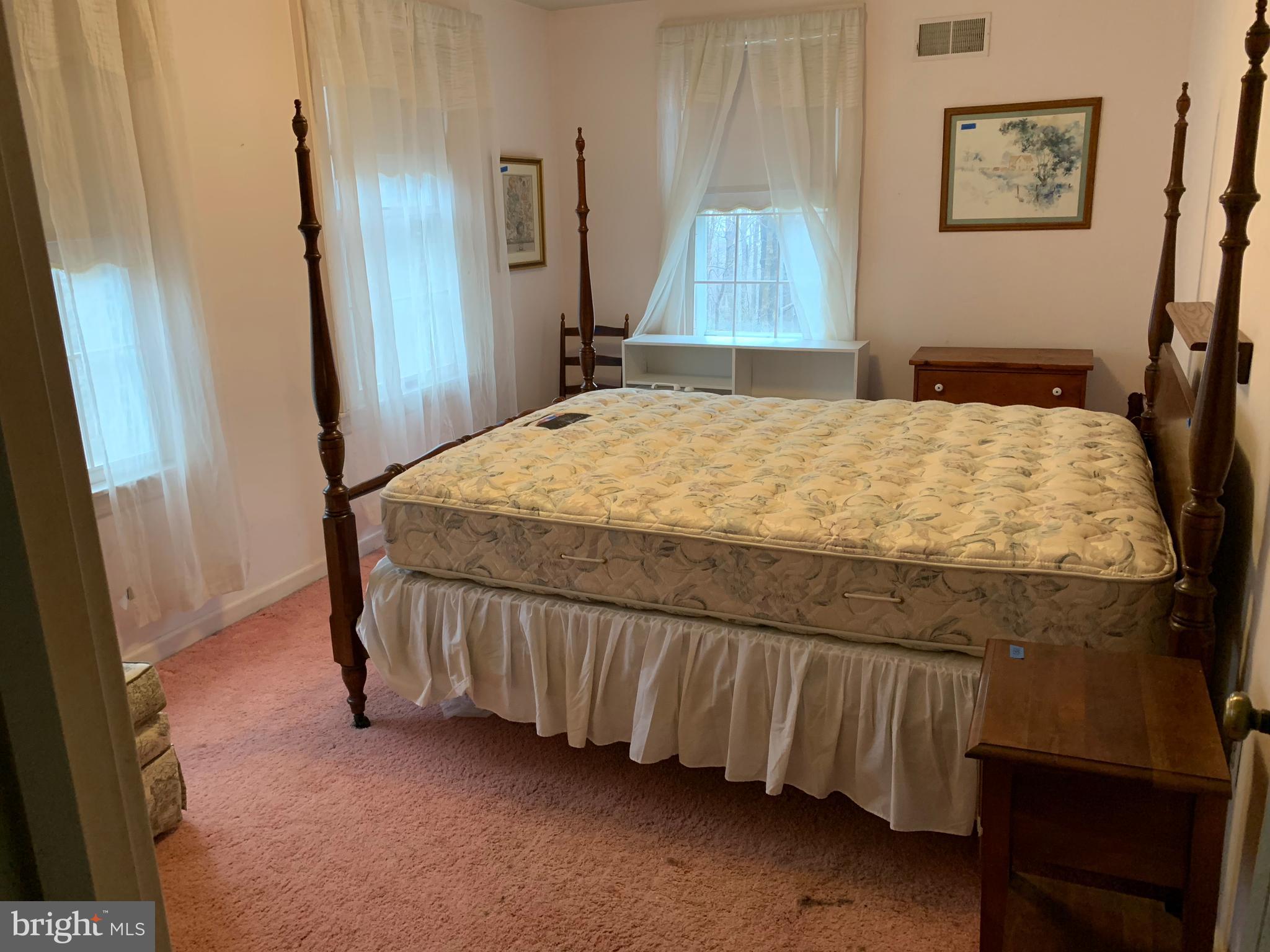 7603 Irongate Lane Frederick, MD 21702 - Photo 38 of 43 a bed sitting in a bedroom next to a window