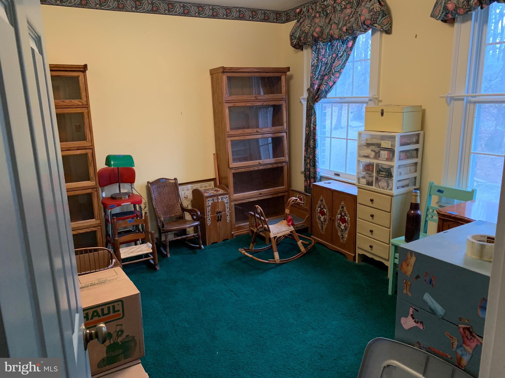 7603 Irongate Lane Frederick, MD 21702 - Photo 40 of 43 a room with furniture and a wooden floor