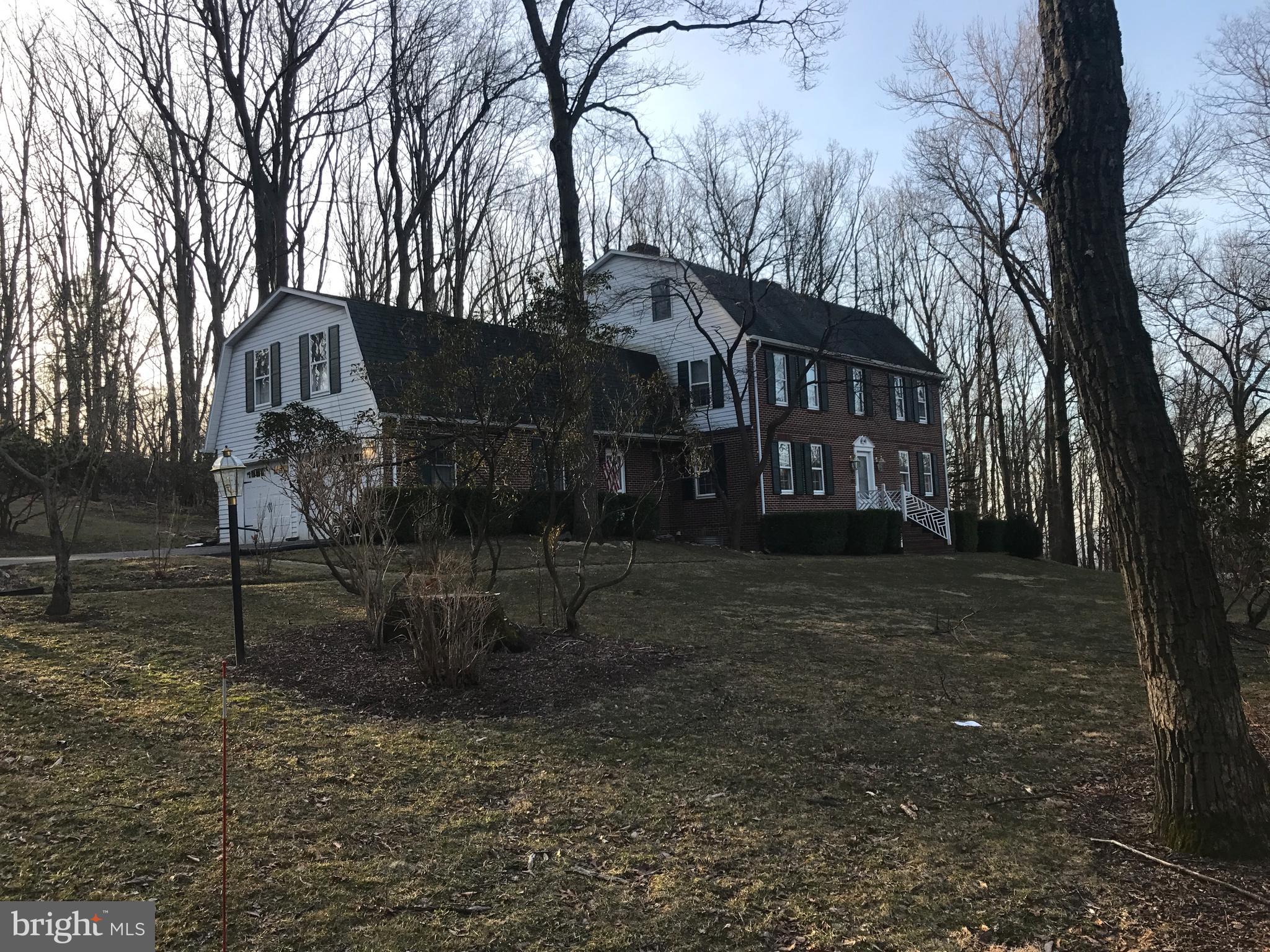 7603 Irongate Lane Frederick, MD 21702 - Photo 5 of 43 a view of a house with a yard