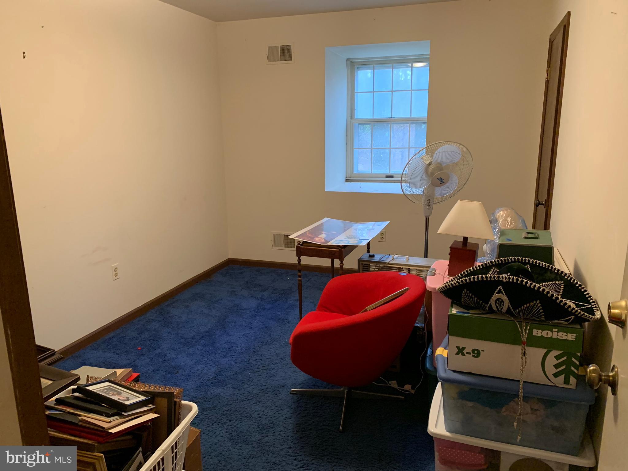 7603 Irongate Lane Frederick, MD 21702 - Photo 42 of 43 a room with furniture and wooden floor