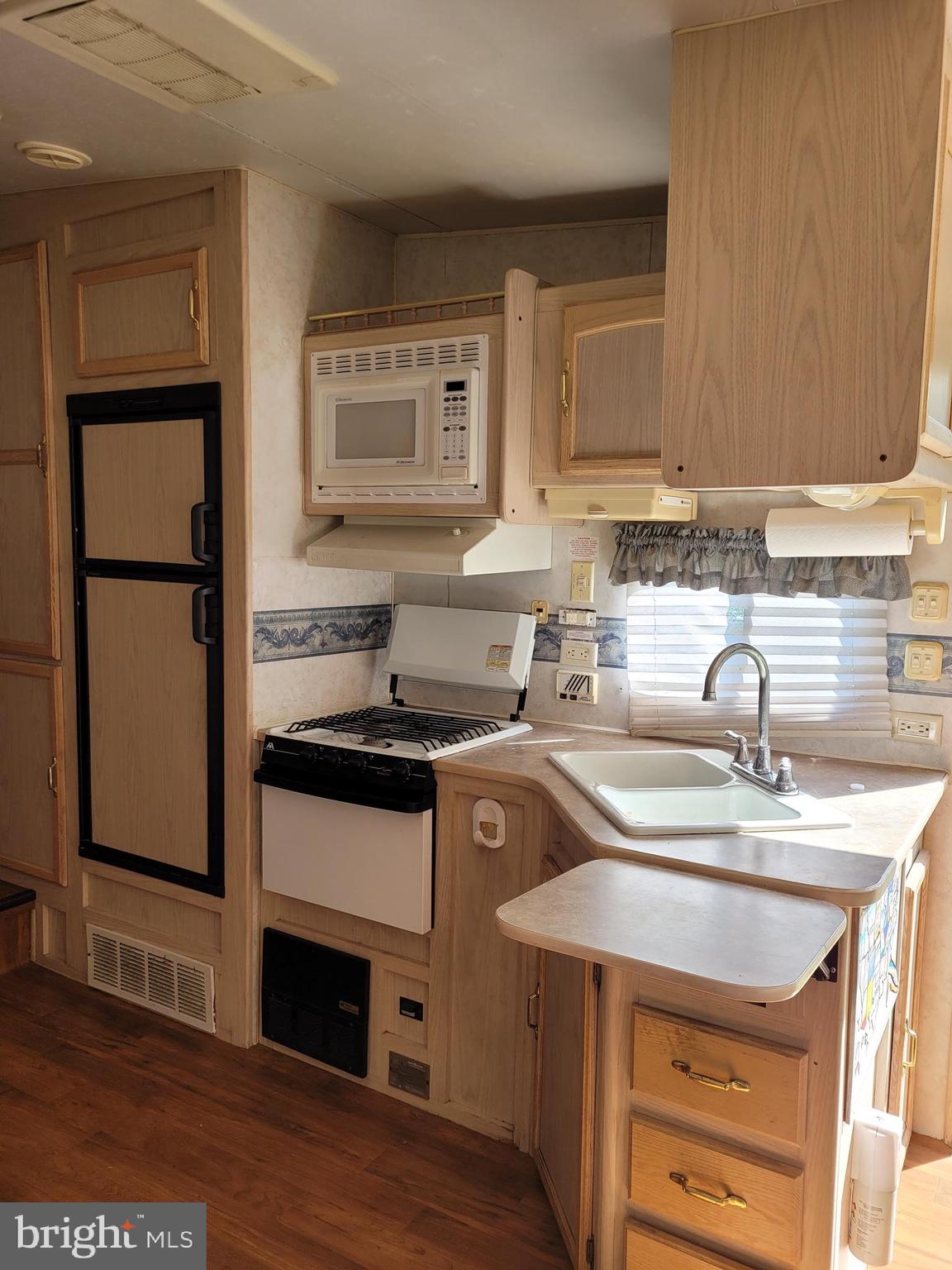 0 South Burlington Road Bridgeton, NJ 08302 - Photo 13 of 18 a kitchen with a sink a stove and cabinets