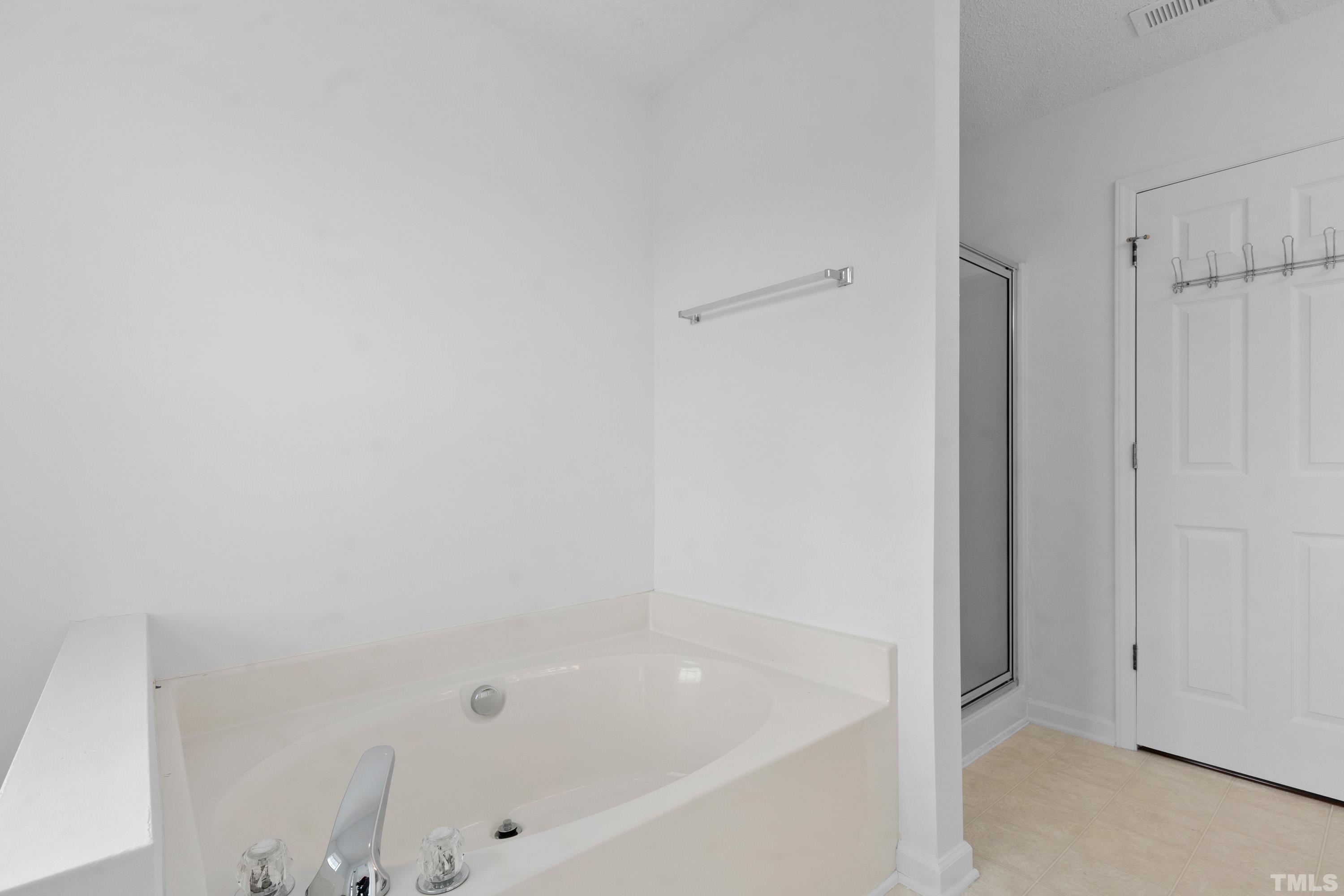 110 Saddle Ridge Drive Willow Spring, NC 27592 - Photo 21 of 32 a close view of a bathtub in bathroom
