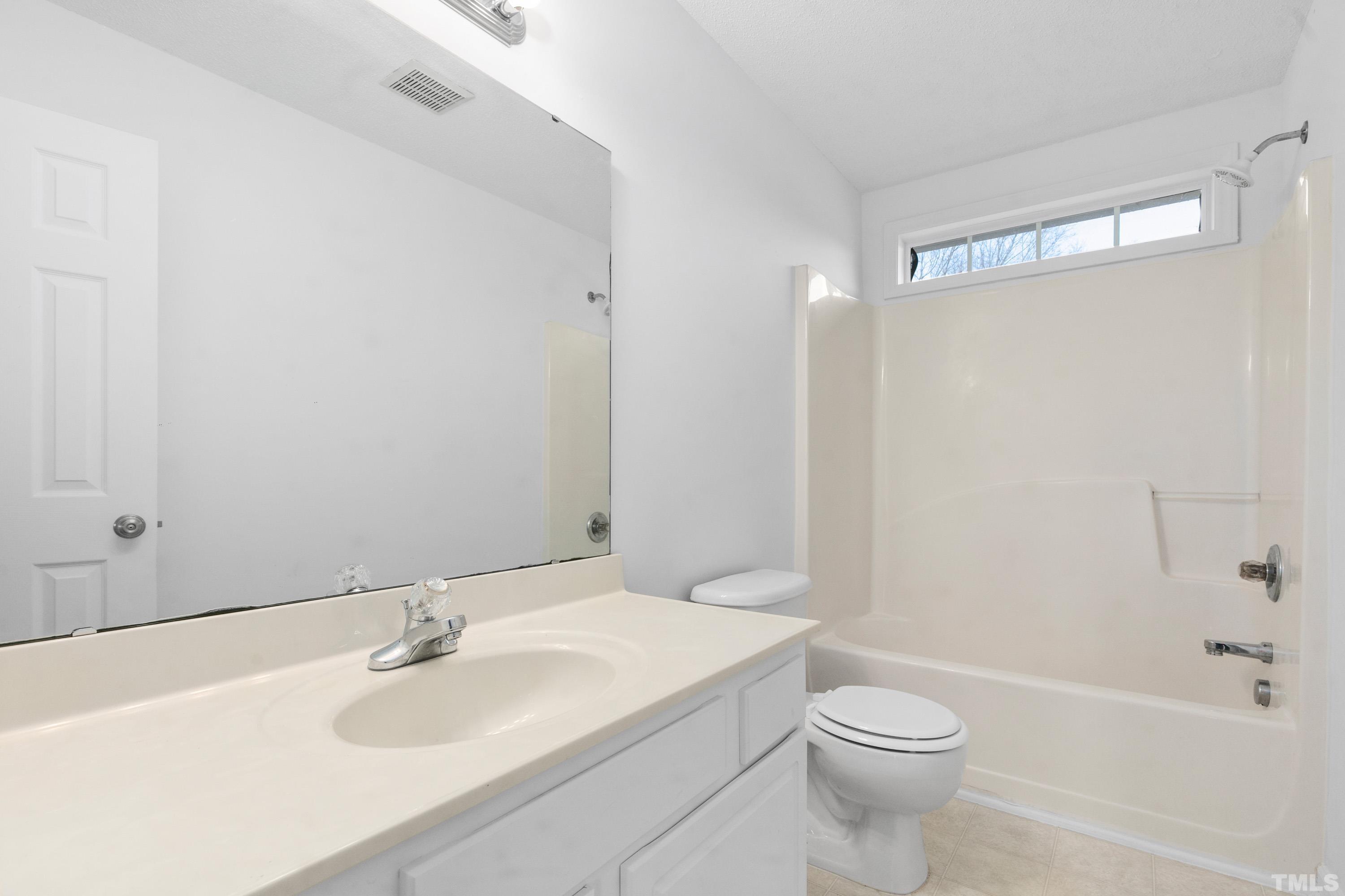 110 Saddle Ridge Drive Willow Spring, NC 27592 - Photo 22 of 32 a bathroom with a sink toilet and shower