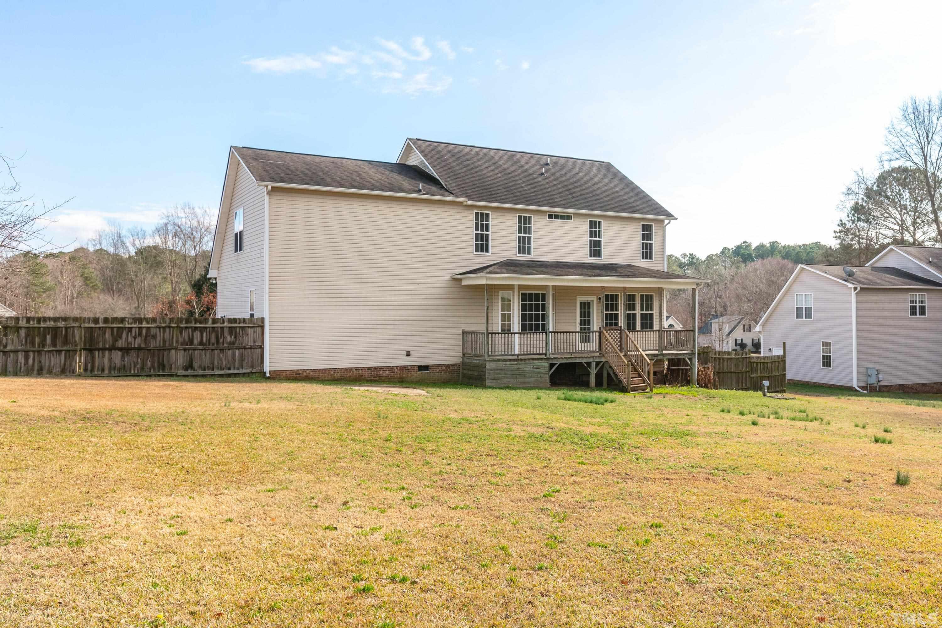 110 Saddle Ridge Drive Willow Spring, NC 27592 - Photo 31 of 32 a front view of a house with a yard