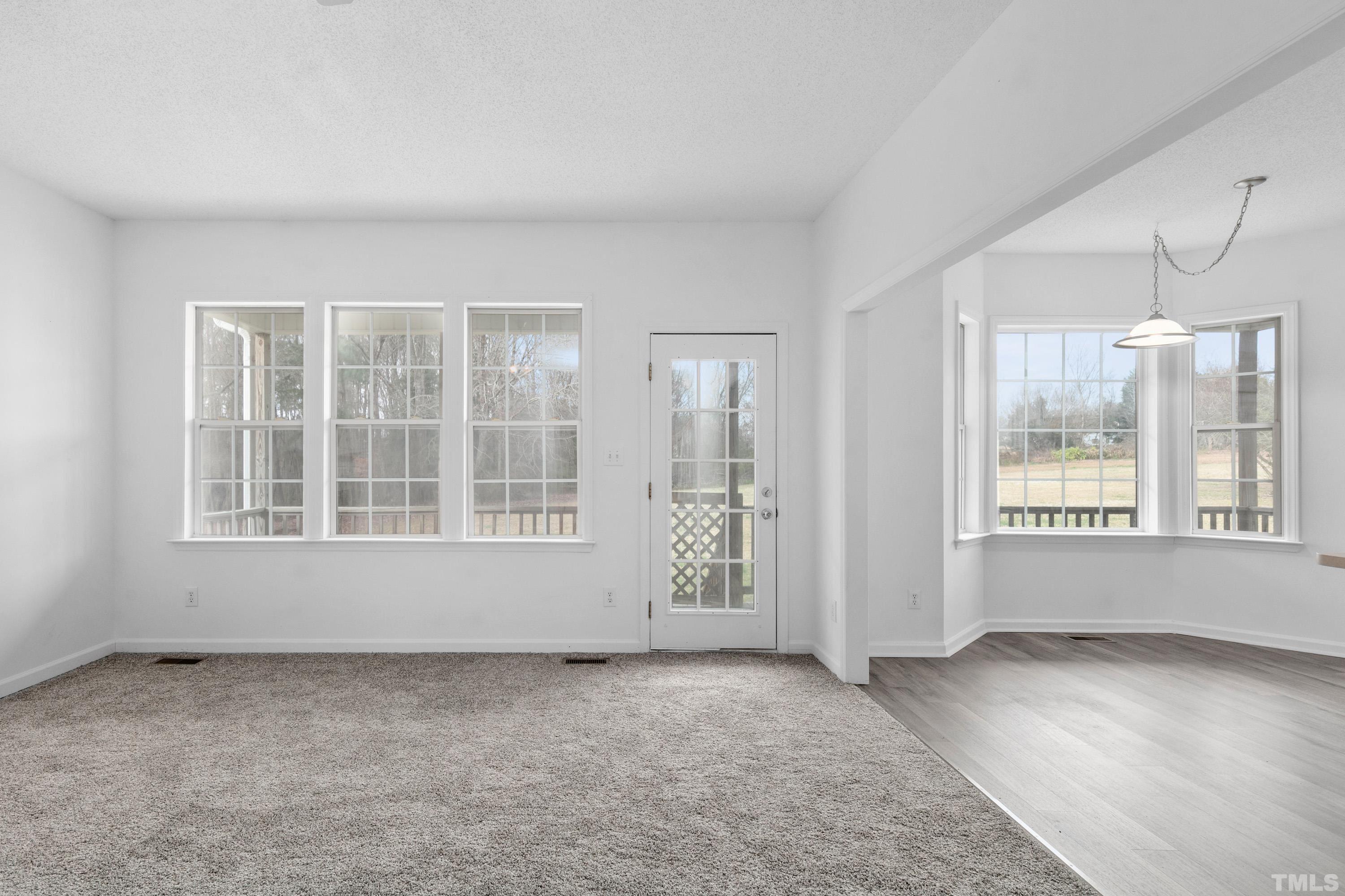 110 Saddle Ridge Drive Willow Spring, NC 27592 - Photo 10 of 32 an empty room with windows