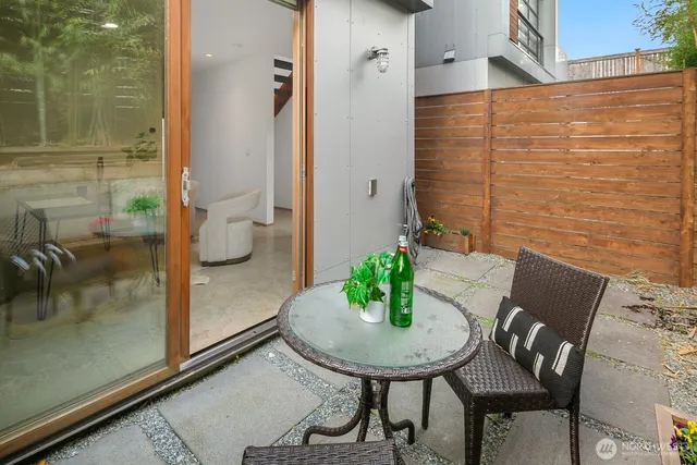 a outdoor dining space with furniture and garden view