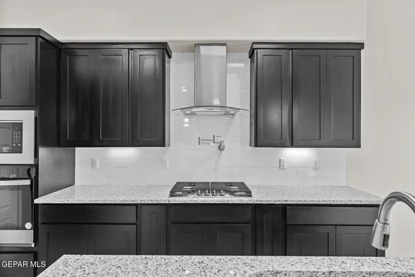 a kitchen with a sink and a refrigerator