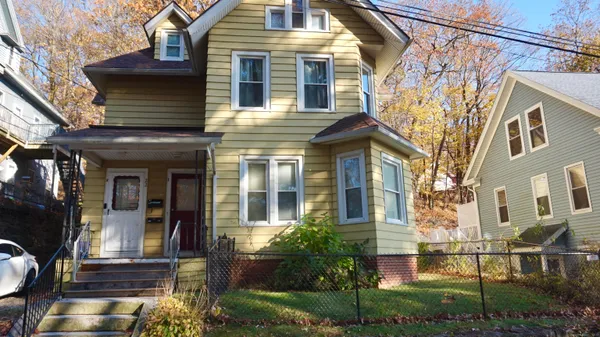 a view of a house with a yard