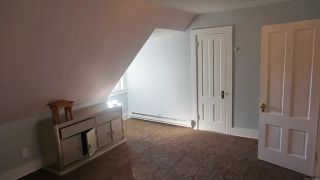 a view of a room with wooden walls