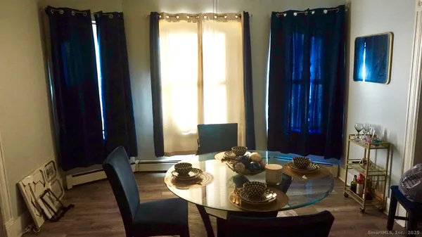 a view of a dining room with furniture window and outside view