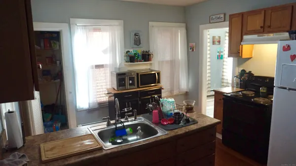 a utility room with dryer washer and a window