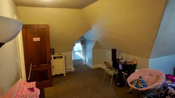 a view of a room with wooden walls