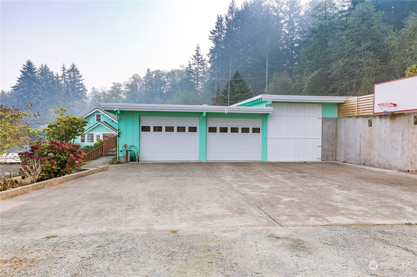 4736 Sharpe Road Anacortes, WA 98221 - Photo 31 of 40 a front view of a house with a yard and garage