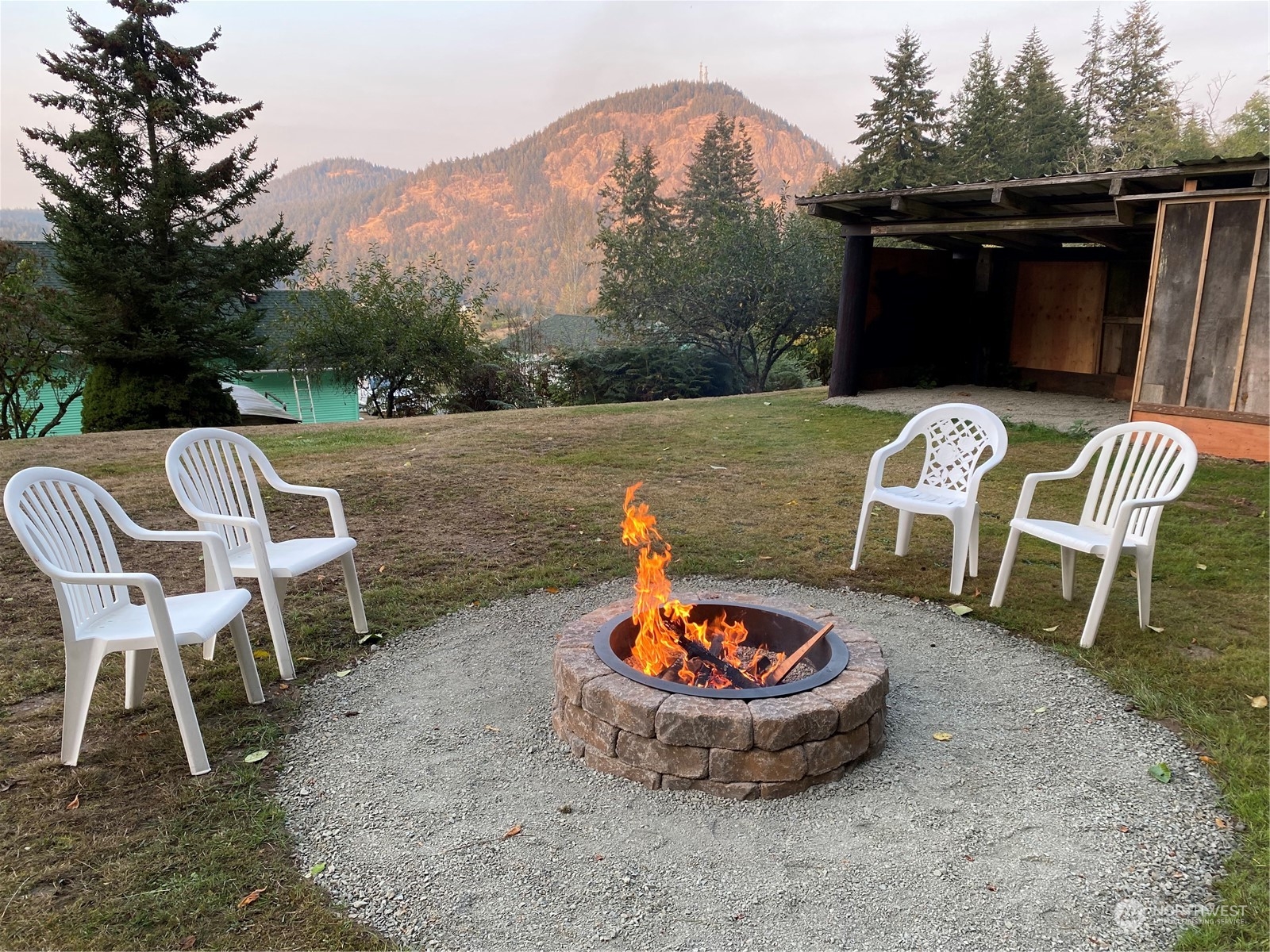 4736 Sharpe Road Anacortes, WA 98221 - Photo 38 of 40 a view of a chairs and table in backyard