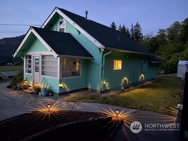 4736 Sharpe Road Anacortes, WA 98221 - Photo 4 of 40 a front view of a house with garden