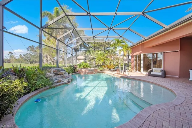 a view of a swimming pool with a patio