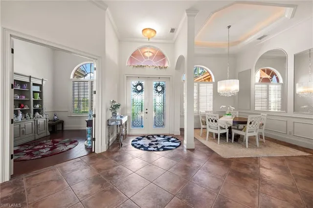 a living room with furniture a rug and a large window