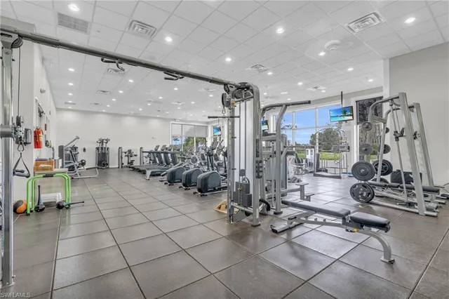 a room with gym equipment and a large window