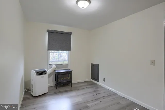a view of kitchen and hall with wooden floor