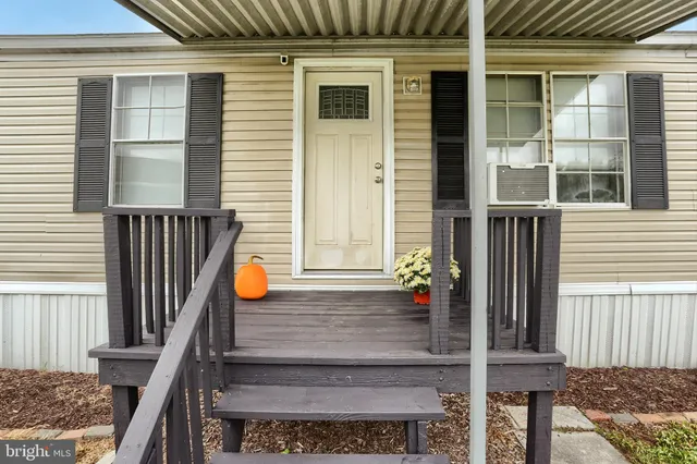 a view of bench in front of house