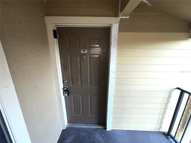 a view of front door with stairs