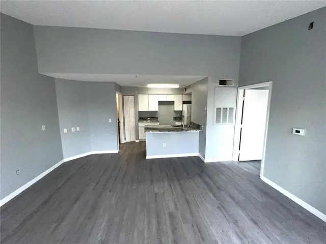 a view of a kitchen with wooden floor
