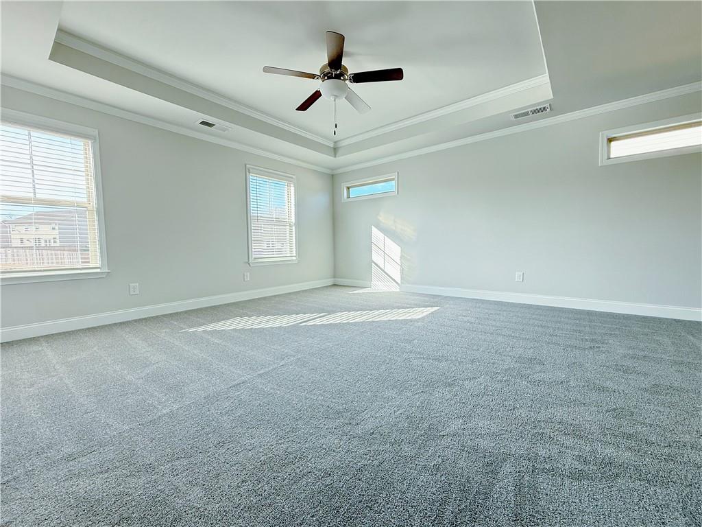 1450 Sunny Valley Lane Braselton, GA 30517 - Photo 11 of 24 a view of a livingroom with a ceiling fan and window