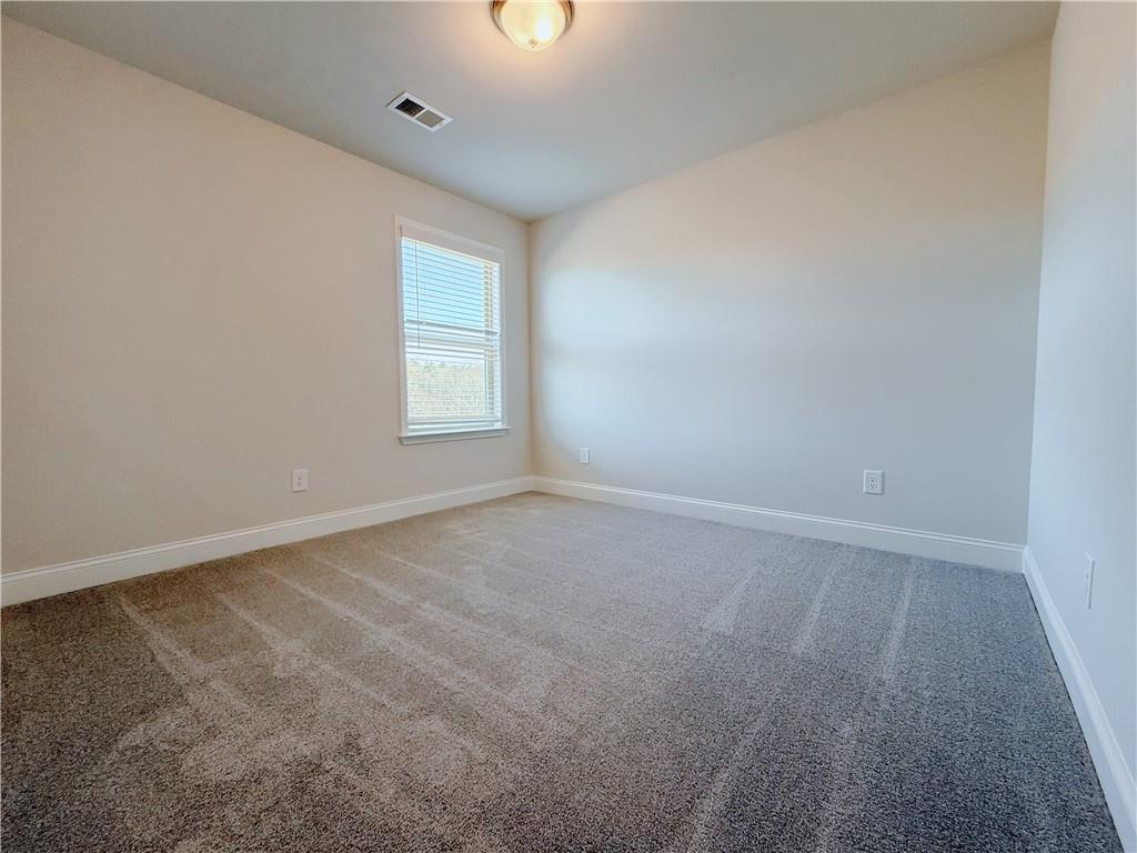 1450 Sunny Valley Lane Braselton, GA 30517 - Photo 15 of 24 an empty room with a window