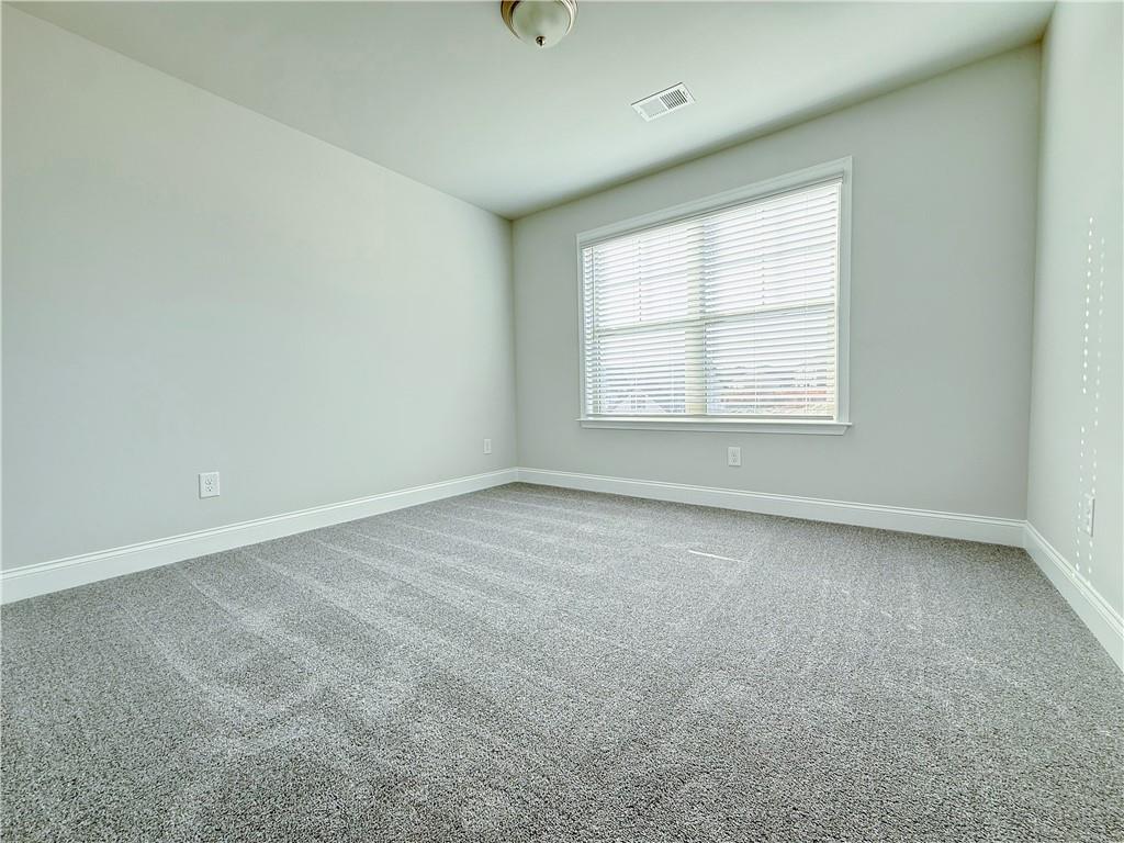 1450 Sunny Valley Lane Braselton, GA 30517 - Photo 17 of 24 an empty room with a window