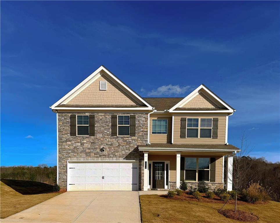 1450 Sunny Valley Lane Braselton, GA 30517 - Photo 2 of 24 a front view of a house with yard