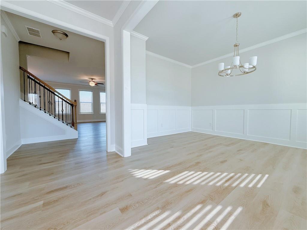 1450 Sunny Valley Lane Braselton, GA 30517 - Photo 3 of 24 a view of an empty room with wooden floor