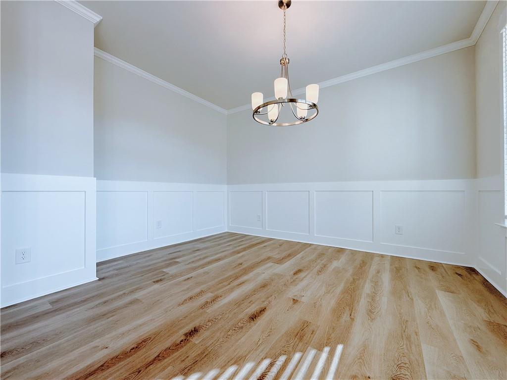 1450 Sunny Valley Lane Braselton, GA 30517 - Photo 4 of 24 a view of an empty room with wooden floor