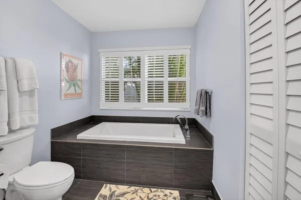 a bathroom with a sink a toilet and a bathtub