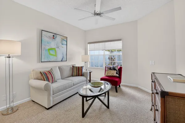 a living room with furniture and a window