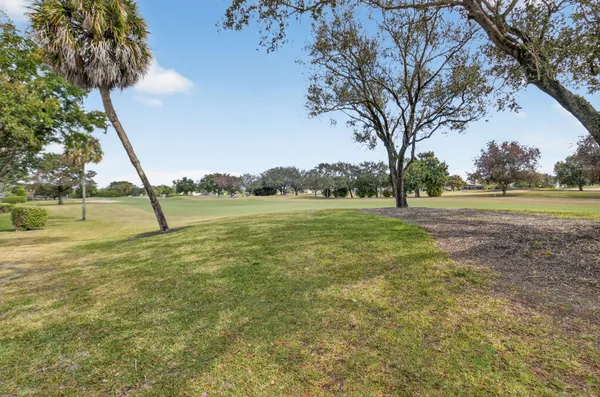 a view of outdoor space with deck and yard