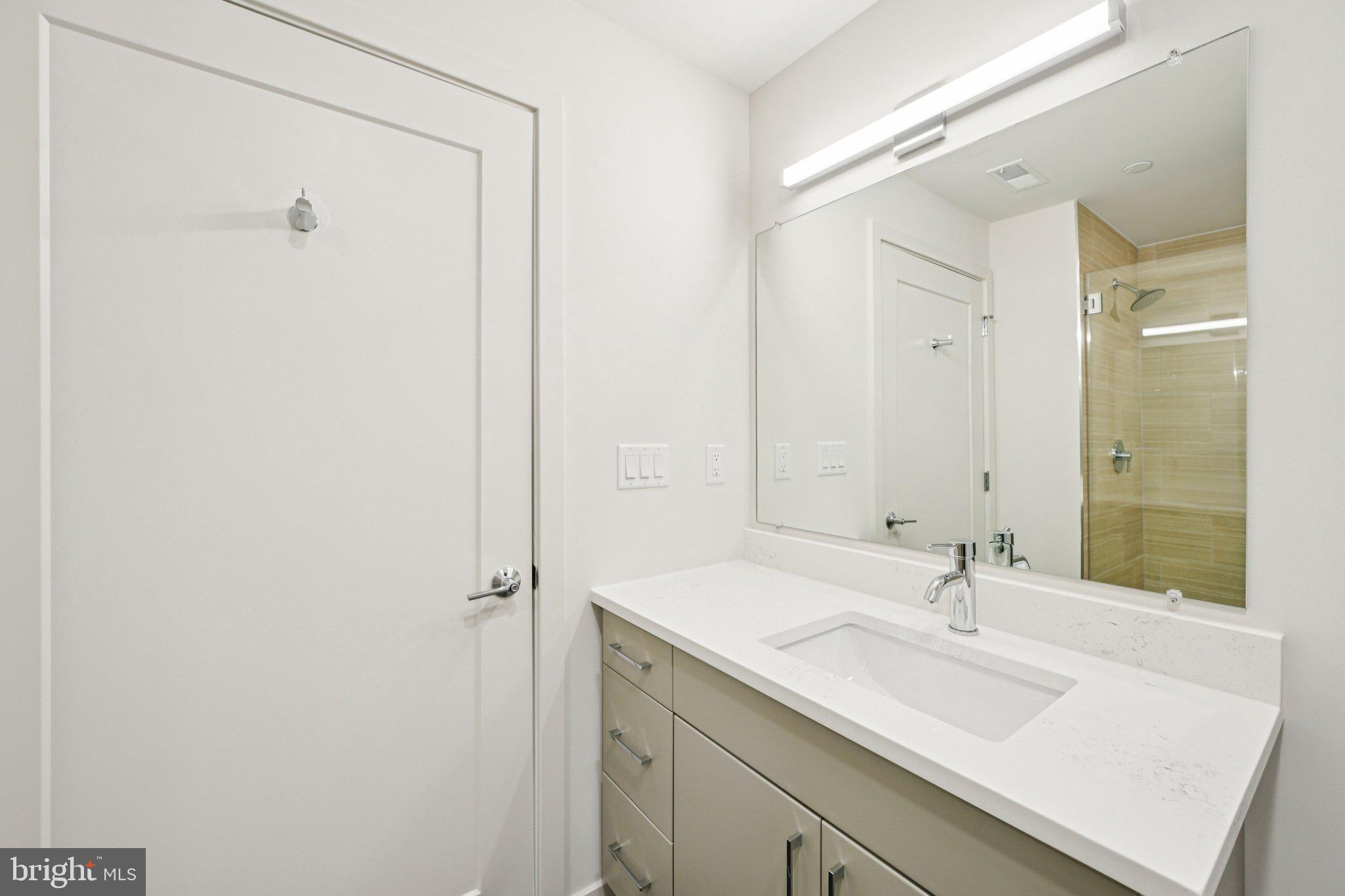 23 Rock Hill Road, Unit 514 Bala Cynwyd, PA 19004 - Photo 7 of 7 a bathroom with a sink and a mirror