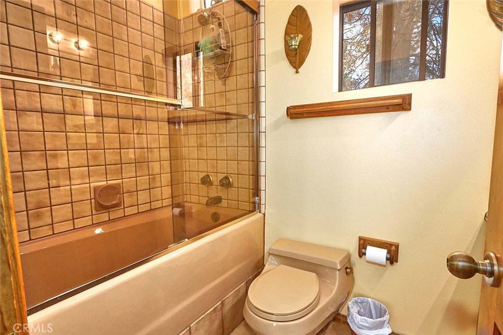 23109 Cardinal Road Wrightwood, CA 92397 - Photo 12 of 49 a bathroom with a toilet and a shower