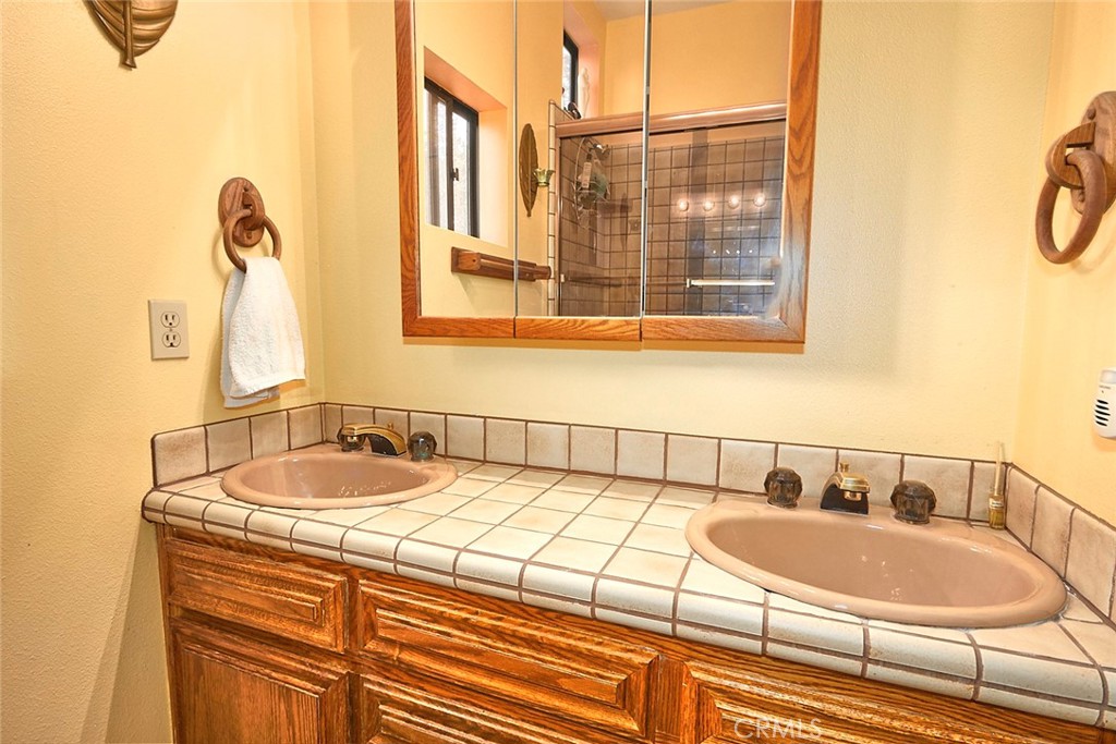23109 Cardinal Road Wrightwood, CA 92397 - Photo 13 of 49 a bathroom with a sink and a mirror