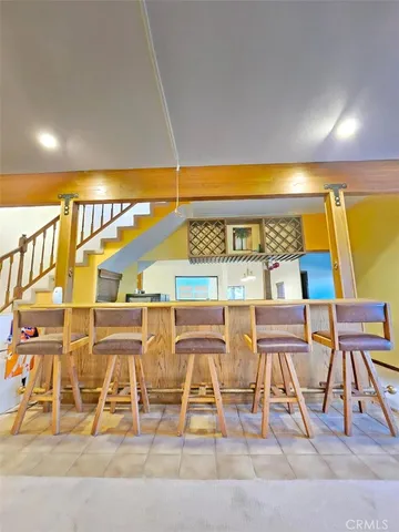 a view of an chairs and table in a room