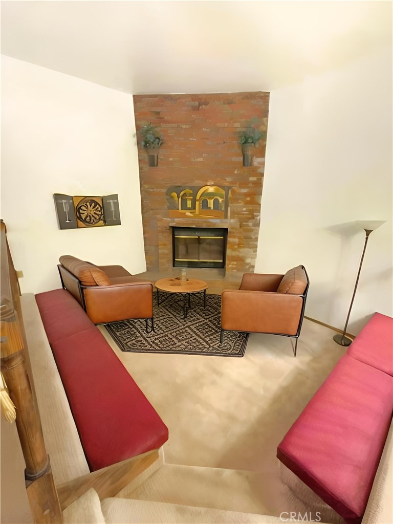 23109 Cardinal Road Wrightwood, CA 92397 - Photo 25 of 49 a living room with furniture and a fireplace