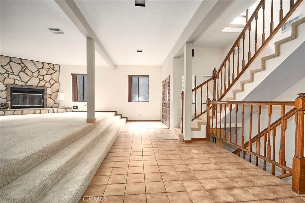 23109 Cardinal Road Wrightwood, CA 92397 - Photo 5 of 49 a view of a hallway with wooden floor and staircase